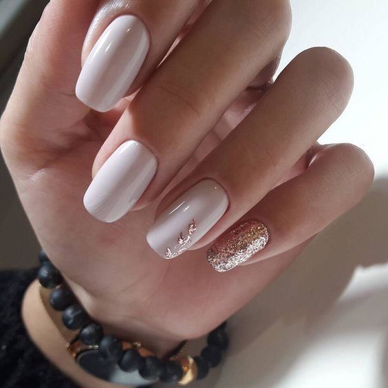 creamy manicure is another great idea of a neutral manicure that looks awesome with tanned skin