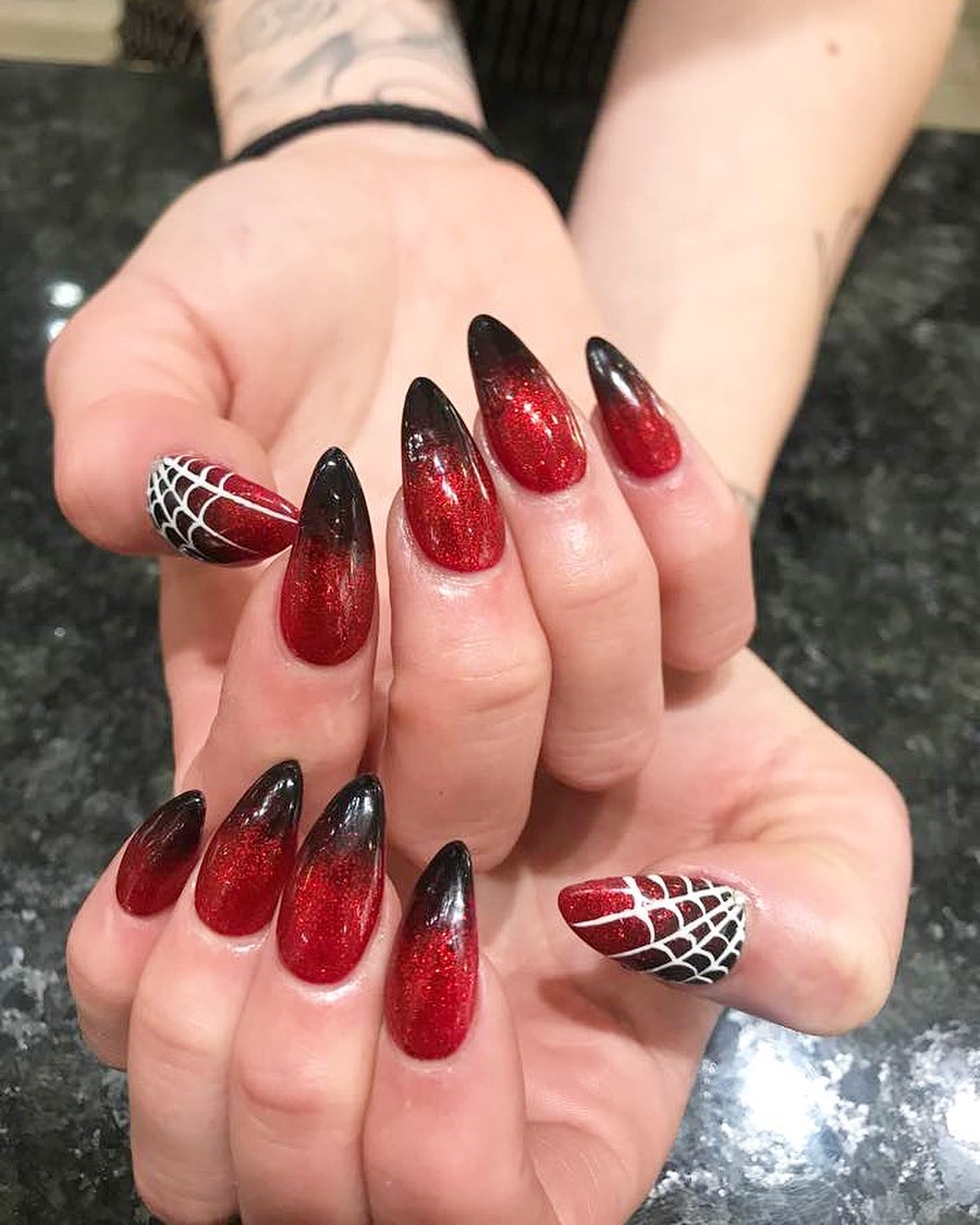 Shimmery Red Nails with Black Tips and Spider Design Nail Art