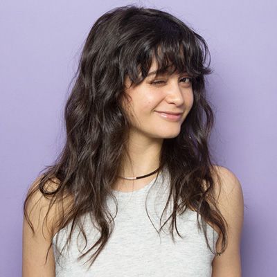 Full curly hair with bangs Style