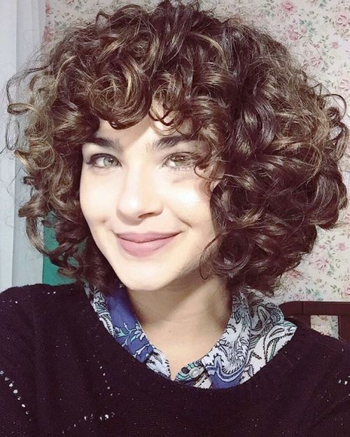 Layered curly hair with bangs