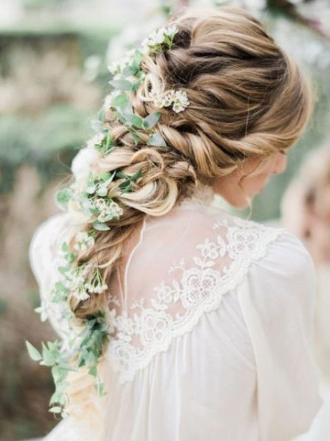 a long textural ponytail with a large braid and a bump looks truly boho chic