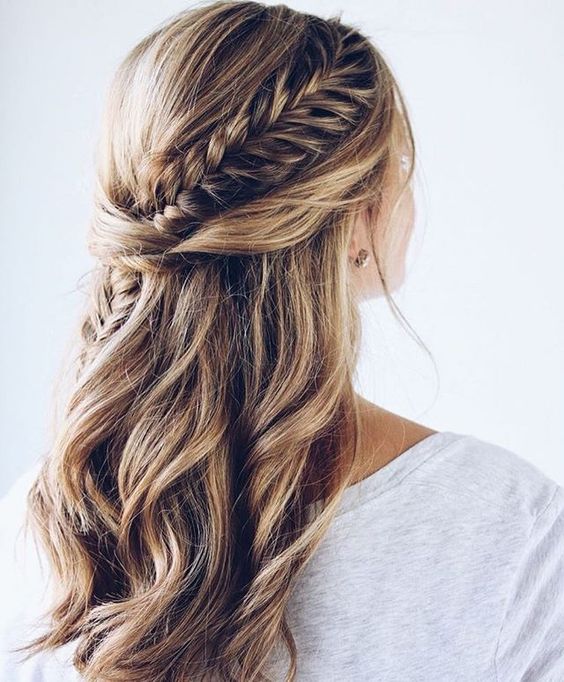 a braided wavy half updo on medium-length hair is a chic idea