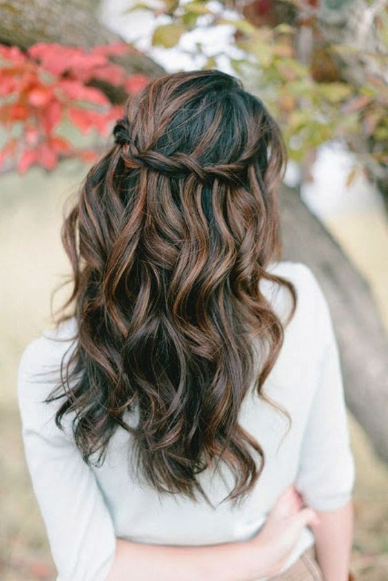 a twisted half-up braid with beach waves is a chic idea for mdeium-length hair and if you don't need anything formal