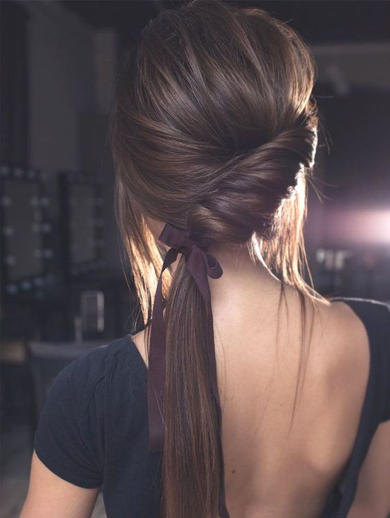 a gorgeous sleek twisted ponytail is the best option for a minimalist bride