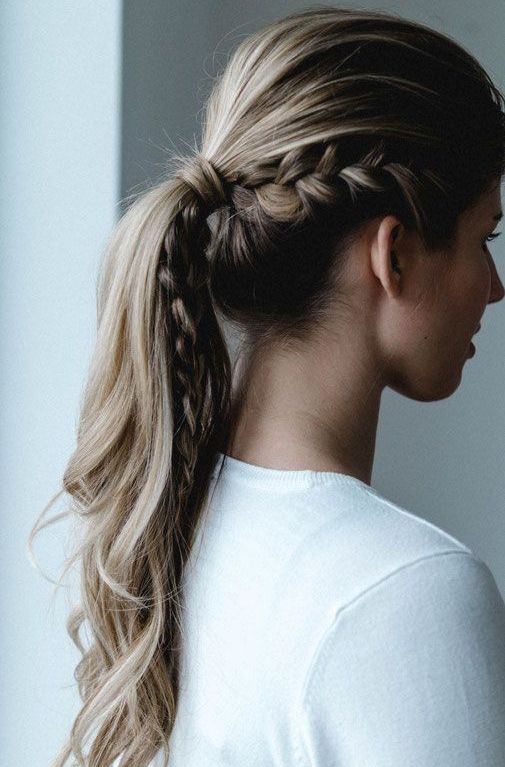 a casual low ponytail with volume on top, texture, dimension and some waves is ideal for a boho or modern bride