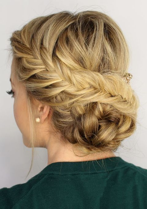a braided crown going down to a low bun for those who have long hair