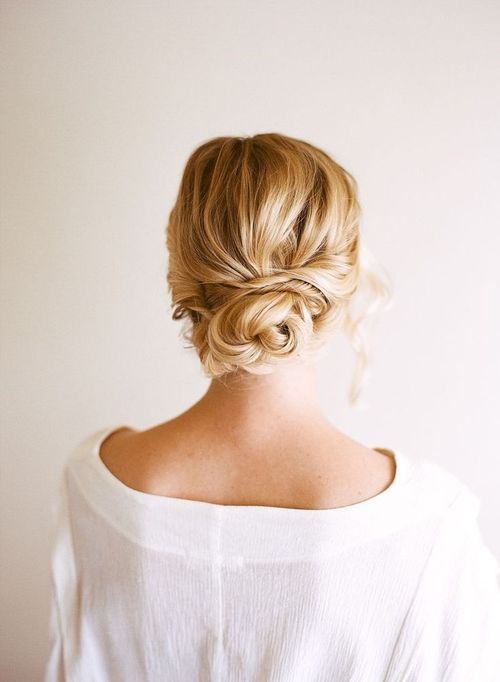 a very messy updo with a low bun and locks down for a casual and effortlessly chic look