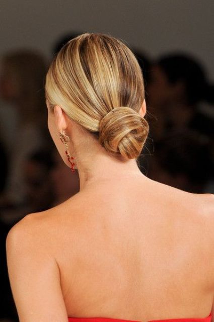 an elegant low bun with a bump and locks down will add chic to your bridal look