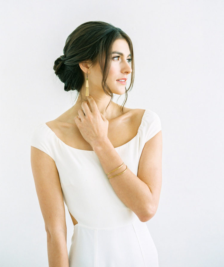 a minimalist sleek ballet bun is a chic statement for a minimal bride to rock on a big day