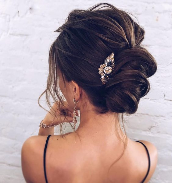 an elegant sleek low bun with a twist is a chic idea and will bring a elegant flavor