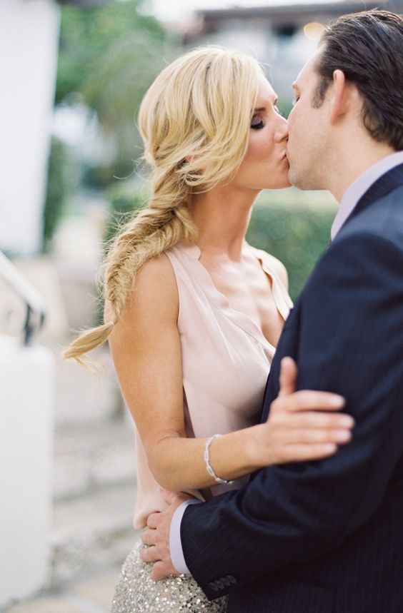 a braid going into a low ponytail with a bit of mess is great for a boho bride-to-be