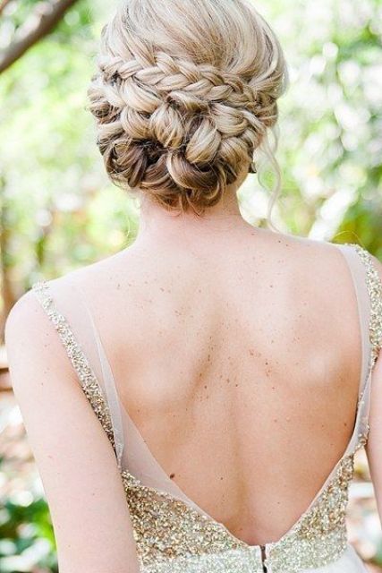 a loose braided updo with locks down is ideal for a boho chic bride