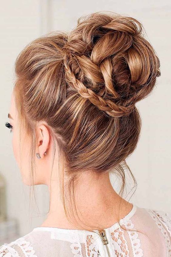 a fully braided top knot is a cool take on a traditional top knot and braids are veyr trendy