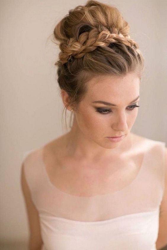 a triple French braid with a top knot is a wow idea for a rustic or boho bride