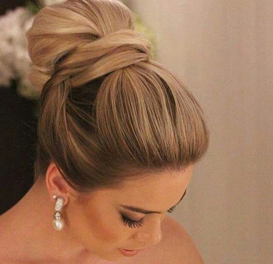 a sleek top knot decorated with a fishtail braid is an edgy and cool idea to rock