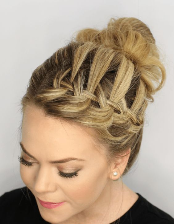 a wavy and curly top knot and a bump spruced up with a braid and some locks down is a wow option