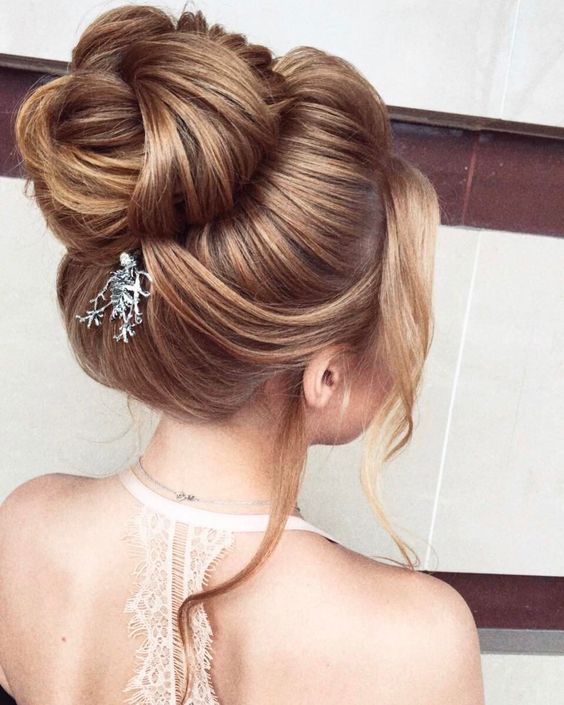 a top knot can be accented with a rhinestone and pearl hairpiece on one side and you may wear matching earrings