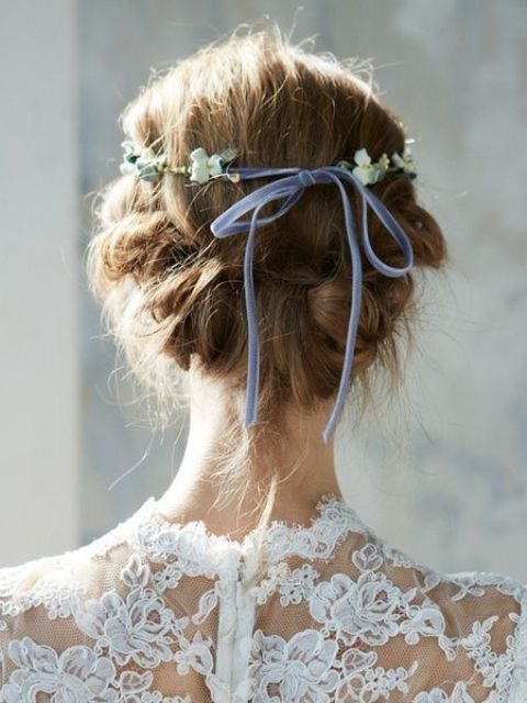 a viking-inspired wedding hairstyle, a half updo with a double braided halo and some braids hanging down