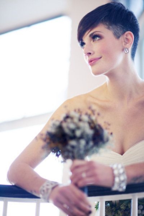 a cool short wedding hairstyle accessorized with a rhinestone and pearl headband for a glam look