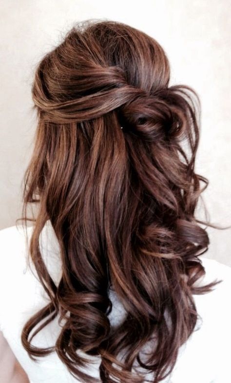a twisted half up half down hairstyle with waves looks very romantic and beautiful