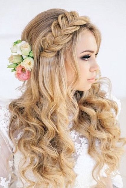 curled half updo with a headpiece
