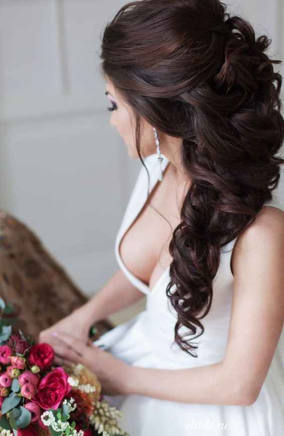 a side swept braid can be highlighted with a beautiful hairpiece