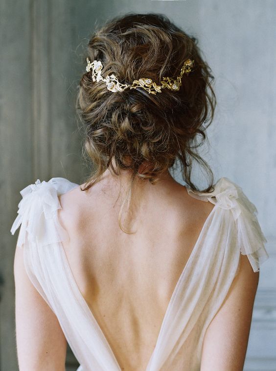 messy curly wedding updo is a natural and chic choice
