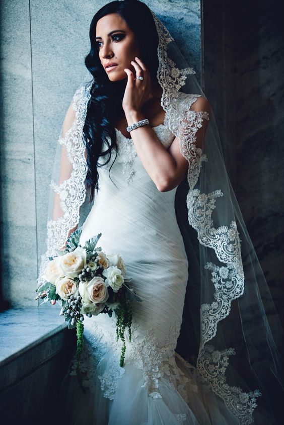curled updo wwith a mantilla veil