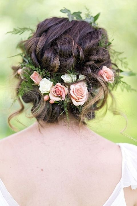 twisted updo with a fresh green sprig