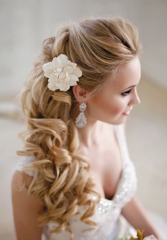 braided half updo with fresh blooms and thistle