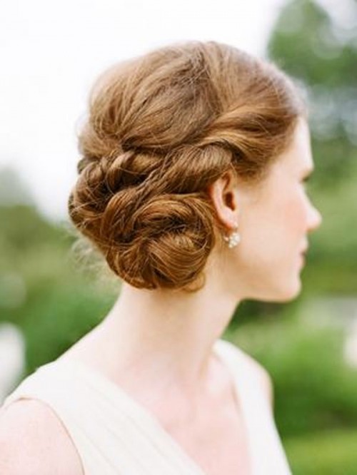 a braided side bun and a side bang are stylish and cool, with a bit of edge