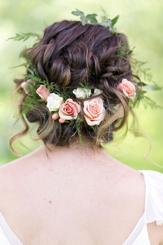 messy braided updo with fresh flowers