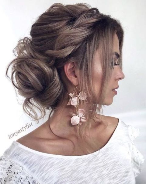 a chic half updo with a bump, a braid and waves down plus bangs for a gorgeous and luxruious bridal look