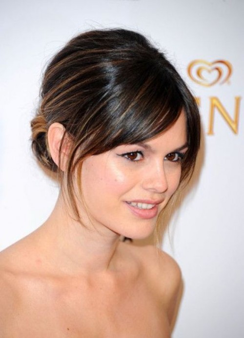 a top knot with a braid and full fringe bangs is great to pull off bold and sexy bridal style with a touch of retro