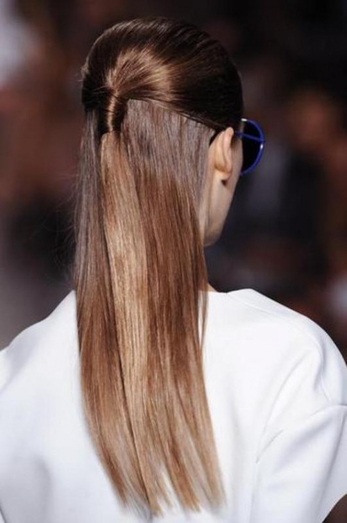 a low ponytail with a large volume on top and hair going down to the back looks modern and refined