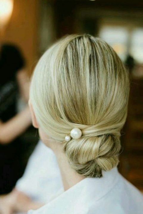 a twisted low bun with a textural top is long-lasting lob styling for a bride or bridesmaid