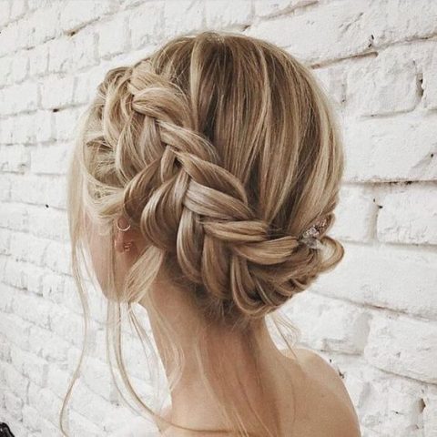 a casual updo with a twisted low bun and a bump plus some locks down