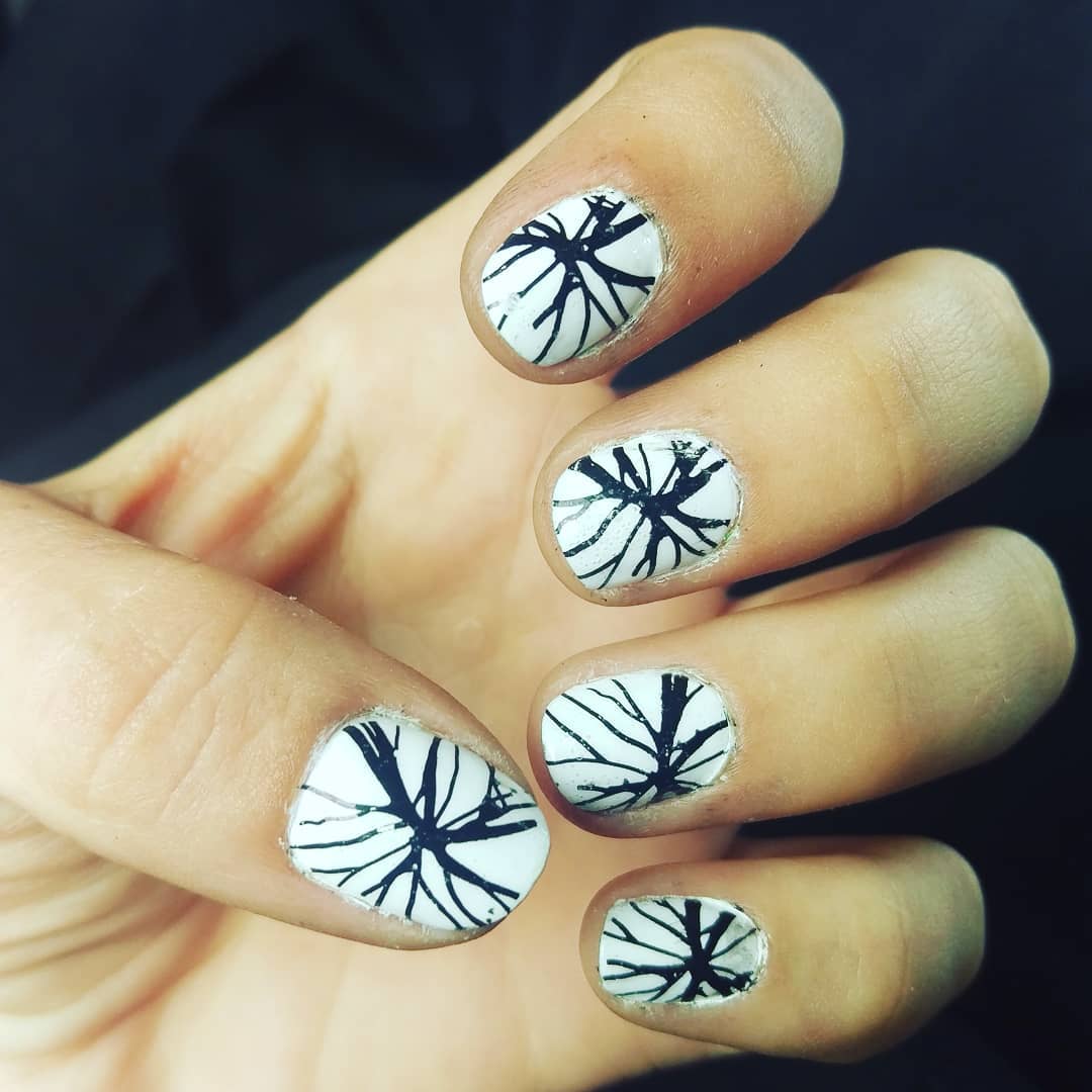 Pure White Nails with Black Spider Design Nail Art