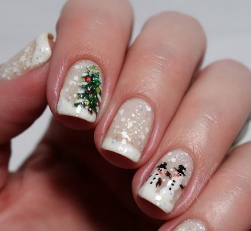 a gold glitter manicure and a bold green accent nail with a snowflake for a modern color-loving bride