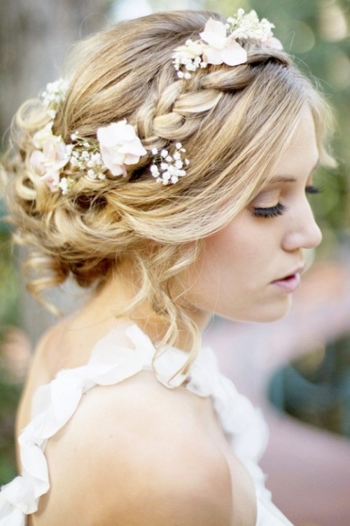 an updo with a dimensional bump, two small braids and bangs is a chic idea with a retro feel