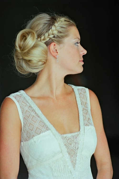 a low bun with bangs to frame the face and a braid on top is a very elegant hairstyle