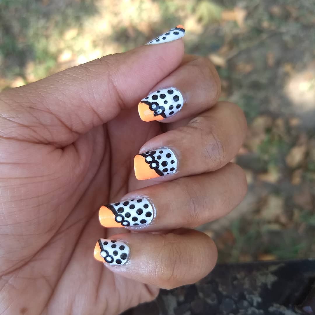 Loving White Nails with Black Polka Dotted Design and Yellow Tips