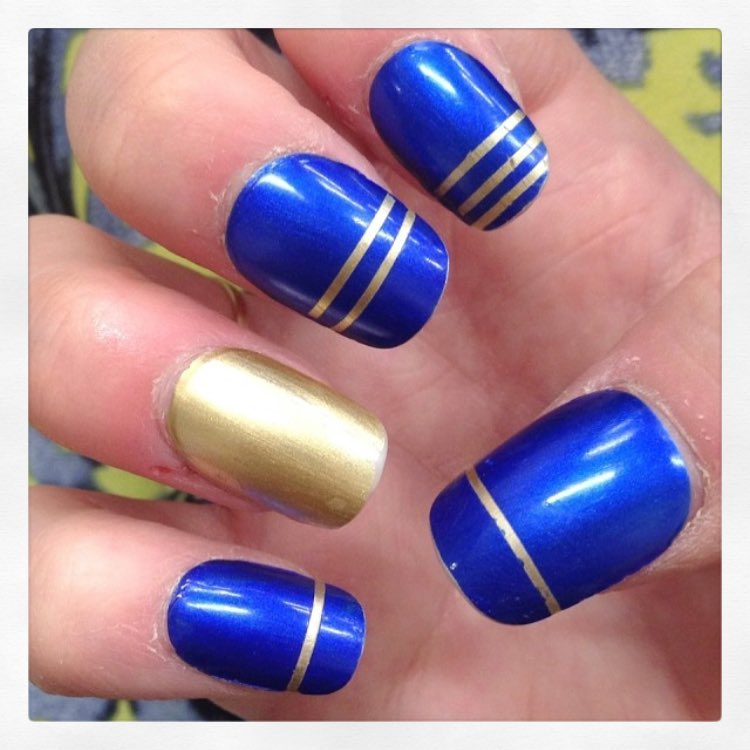 Marvelous Blue Nails with Golden Striped Band Nail Art