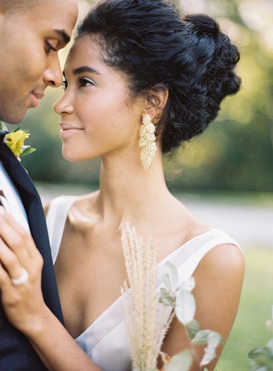 a chic half updo of curls with much texture and an legant cathedral veil for a cute touch
