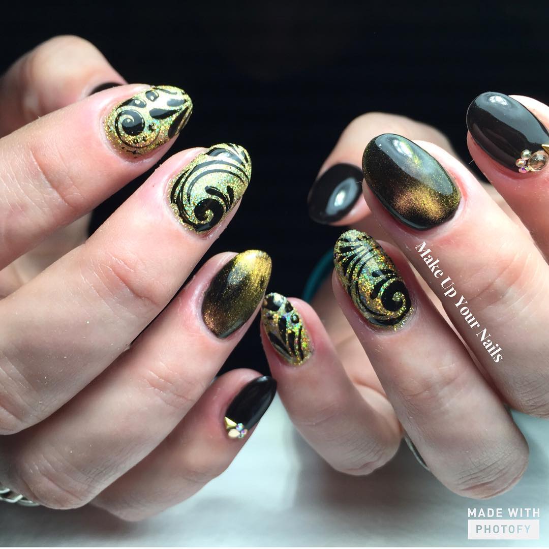 Decorative Golden and Black Nail Art Design