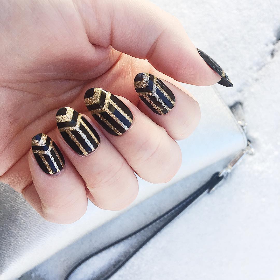 Trendy Black Nails with Golden Nail Art Design