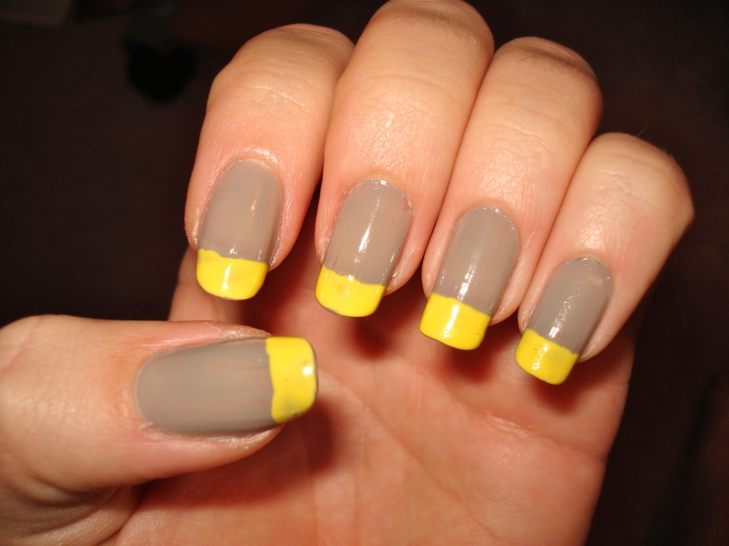 Taupe manicure with bright yellow tips