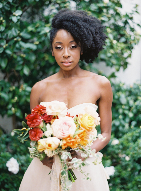 Asymmetrical curly updo