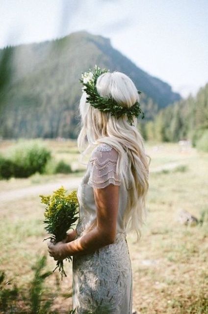 half up half down relaxed hairstyle with fresh leaves instead of blooms