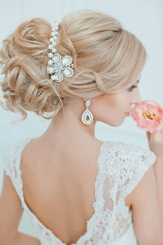 an elegant wedding updo hairstyle with pearl headpiece